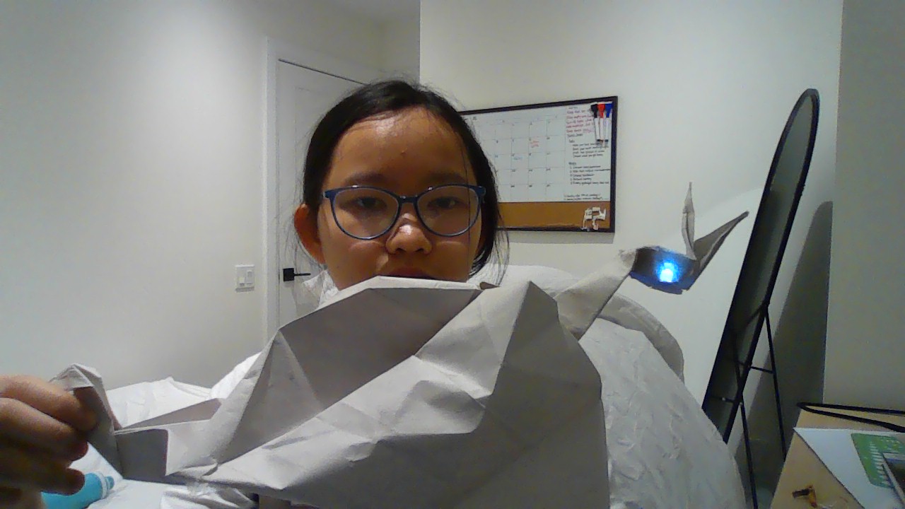 Paper dragon when its tail is pulled. A white light can be seen coming from the eyes.