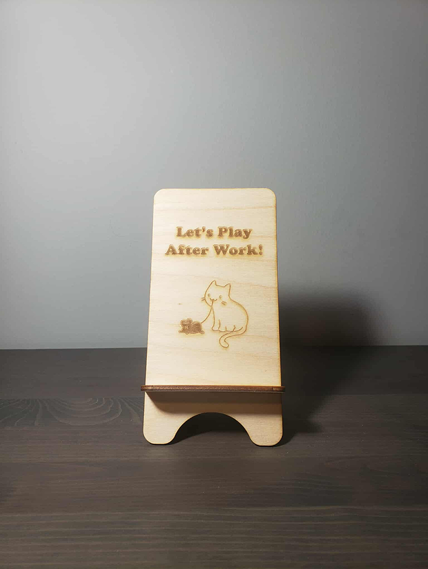 Different views of the wooden phone holder.