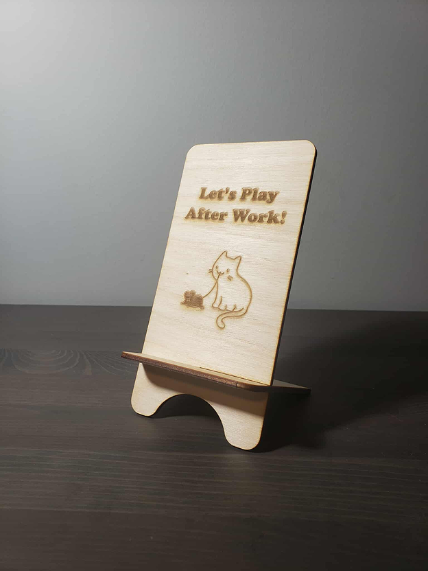 Different views of the wooden phone holder.