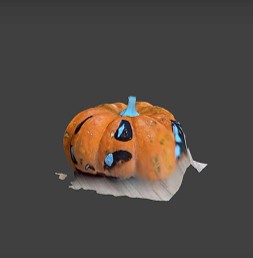 3D scanned colored pumpkin. A part of it is fused with the floor.